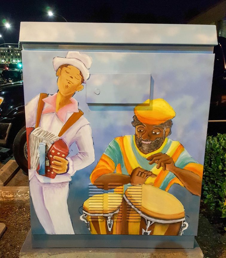 Utility box with art of men playing music